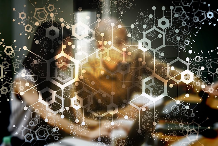 Abstract image of a blurred person in warm tones, overlaid with white hexagonal and molecular patterns, creating a scientific and technological vibe.
